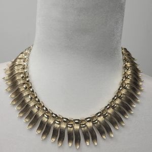 Lisner brushed gold toned leaf bib necklace